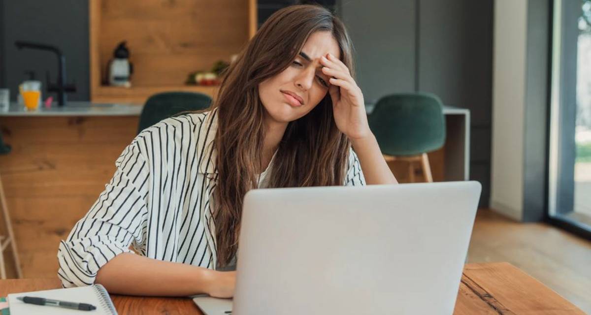 remote worker, woman at laptop, upset woman, remote work, anxiety