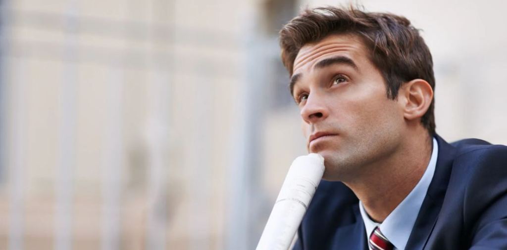 man wondering, man in a suit, man thinking, professional man, career