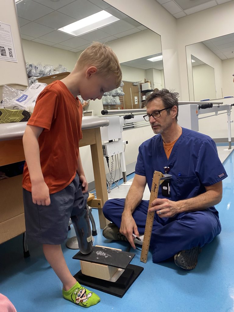 Arlo getting his prosthetic fitted at Shriners Children's.