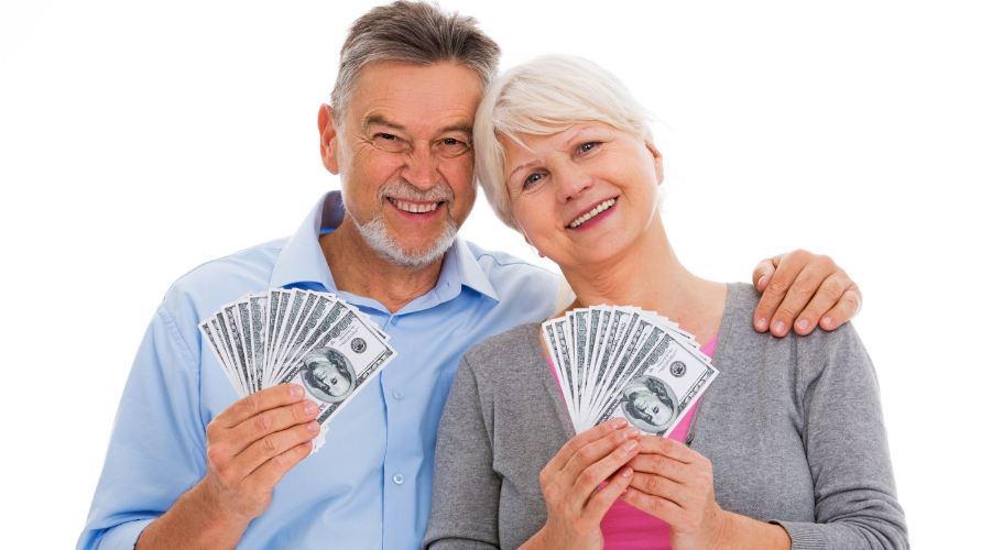 cash, married couple. mature couple, couple holding cash, $100 bills