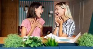 women laughing, good conversation, friends, cheerful talk, fun conversation