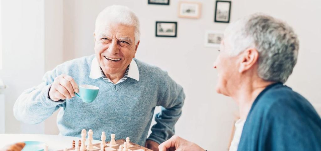 chess, man laughing, friends talking, coffee, smiling man
