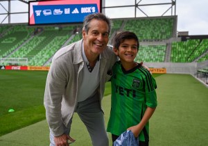 John Harkes coaching a payer at the Summer of '94 community event.