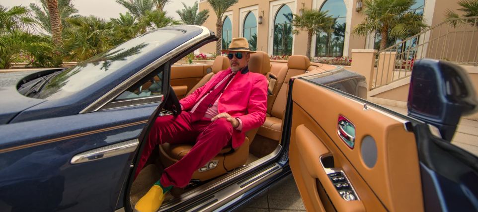 convertible, fancy car, big house, rich guy, man in suit