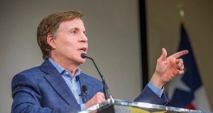 man, jacket, podium, microphone, Bob Costas