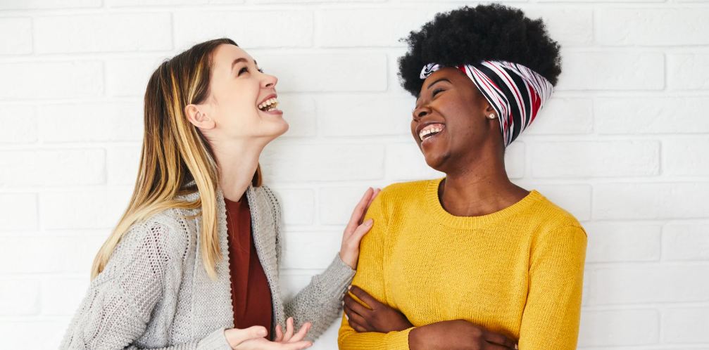 women laughing, women chatting, conversation